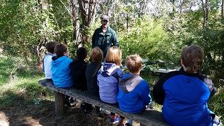 Kids in Outdoor Classroom in Atchison County, Mo - listening to MDC Agent