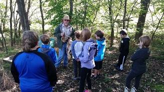 Kids in Outdoor Classroom in Atchison County, Mo listening to MDC Agent