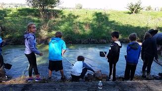 Kids in Outdoor Classroom in Atchison County, Mo - digging in stream