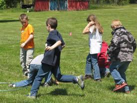 Kids play a game at the 2015 Ag Day at Rudd Farms