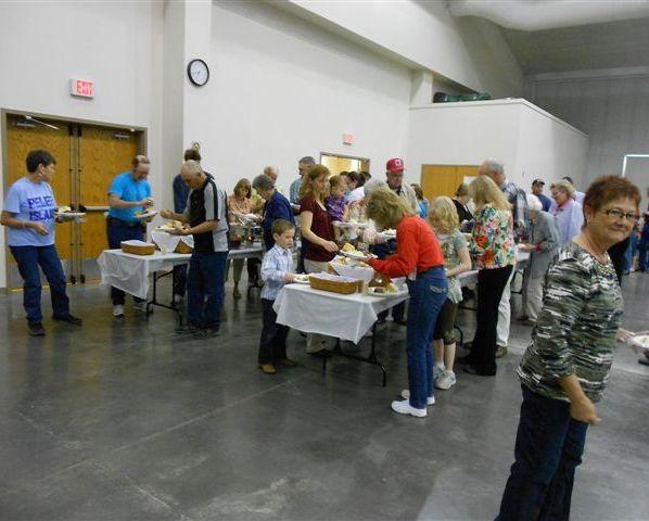 People filling their plates at the meeting