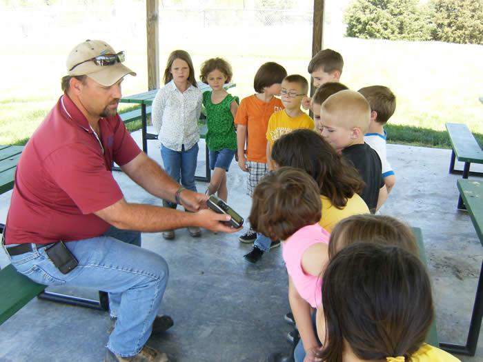 Brian Sturm, NRCS Soil Technician shows the kids how to use the GPS for a fun scavenger hunt!