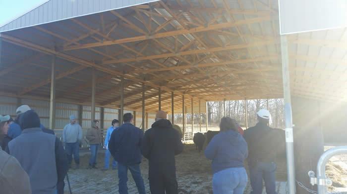 Tour attendees discussing new cow/calf feeding facility with owners, Perry County District Technician and NRCS Engineer.