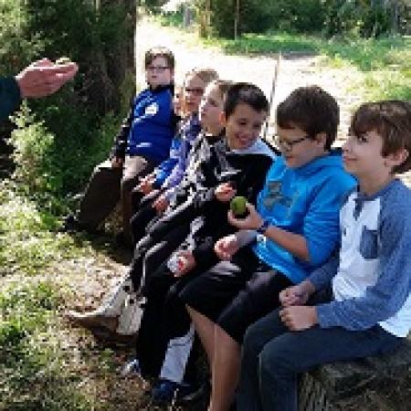 Kids in Outdoor Classroom in Atchison County, Mo listening to MDC Agent