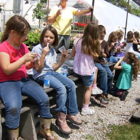 Kids enjoying a treat at the greenhouse